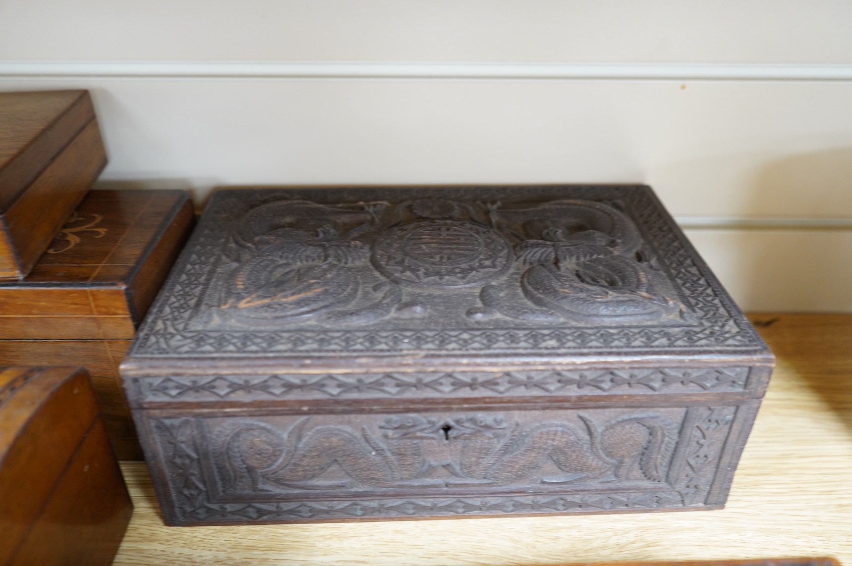 A blonde tortoiseshell veneered box, six other boxes and a miniature bagatelle board